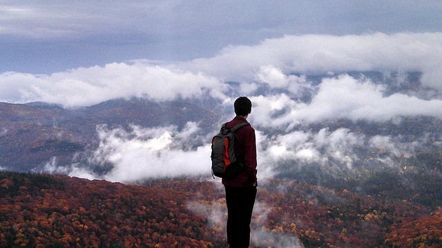Contemplation | Person standing atop a mountain