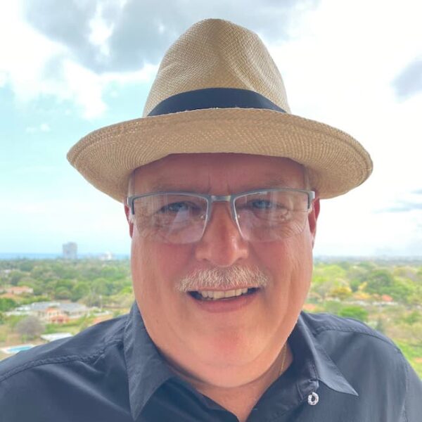 Greg Kitzmiller outdoors wearing a had and dark blue shirt